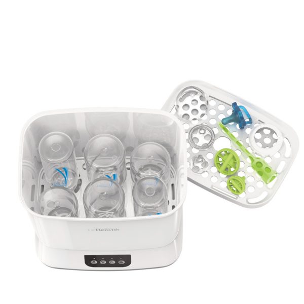 Top view of sterilizer open with bottles inside and tray out loaded with pacifier, nipples, and parts